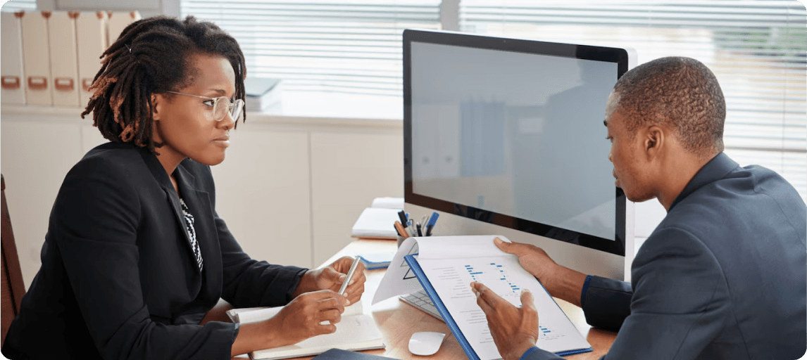 Care Sync Experts consultant reviewing policy documents with a care provider